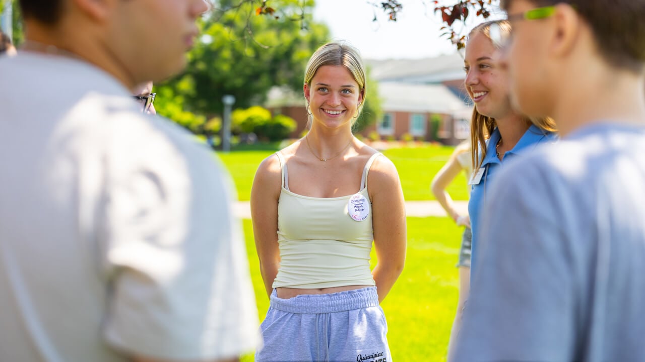 Individual smiling during Orientation