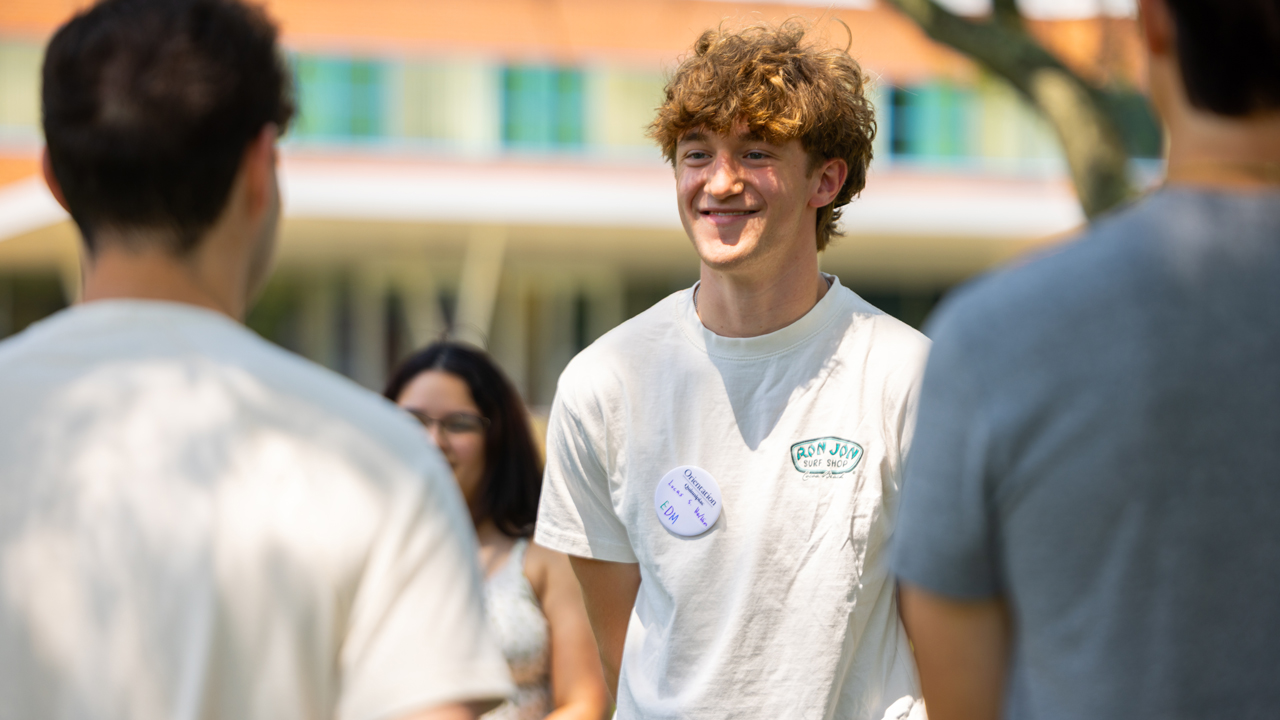 Individual smiling during Orientation