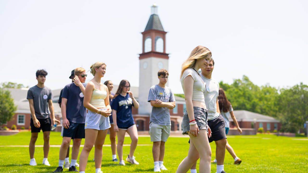 A group of individuals standing on the Quad during Orientation