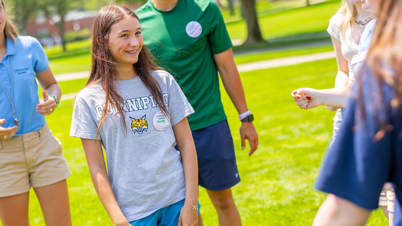 Individual smiling during Orientation