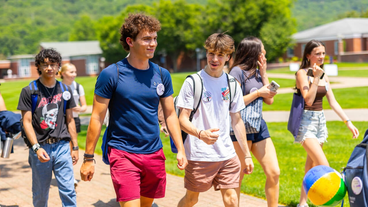 A group of people walking on the Quad during Orientation