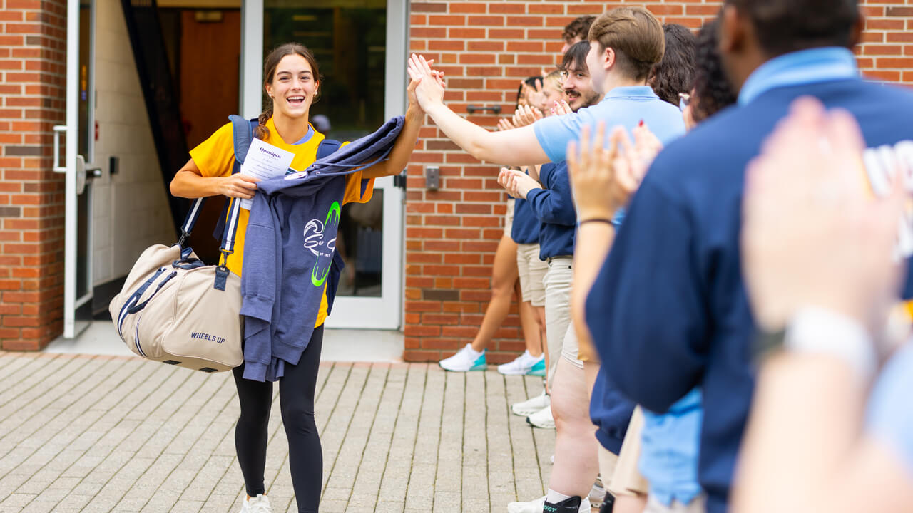 Individual walking out of the Recreation and Wellness Center