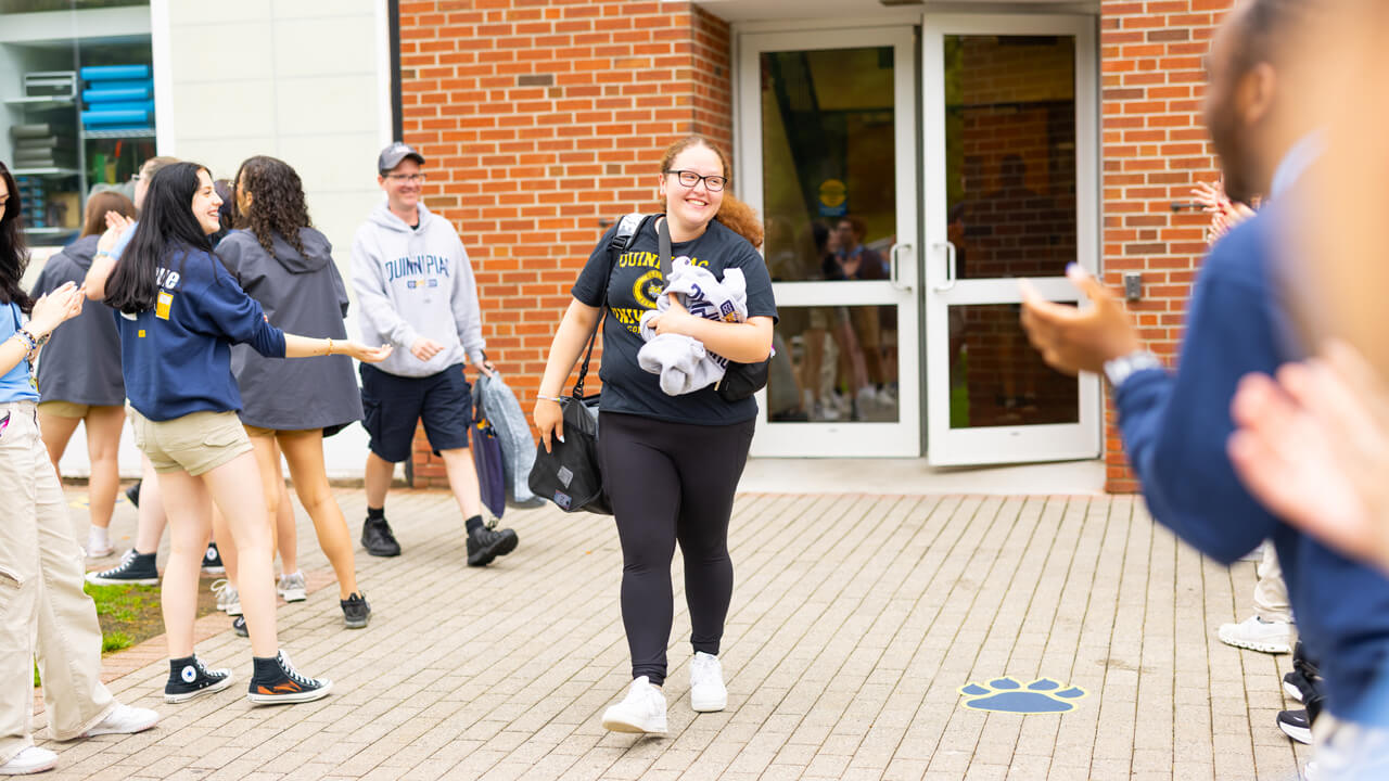 Individual walking out of the Recreation and Wellness Center