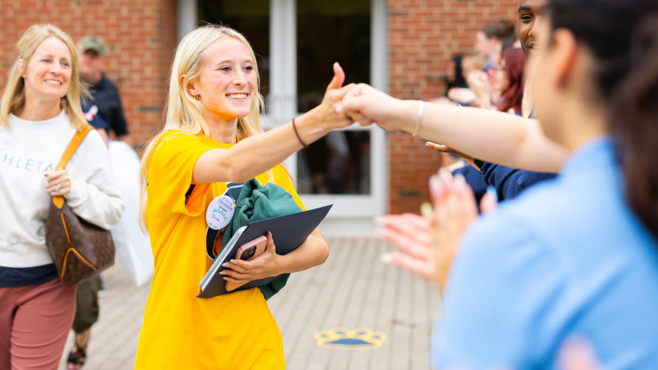 Individual walking out of the Recreation and Wellness Center