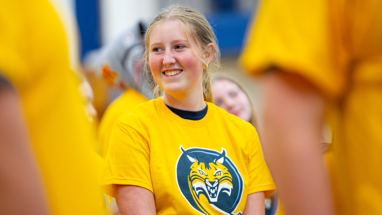 Individual smiling at Orientation