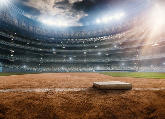 A baseball field with the stadium in the background.