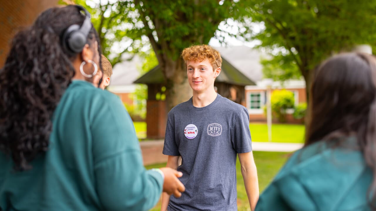 Individuals talking during Orientation