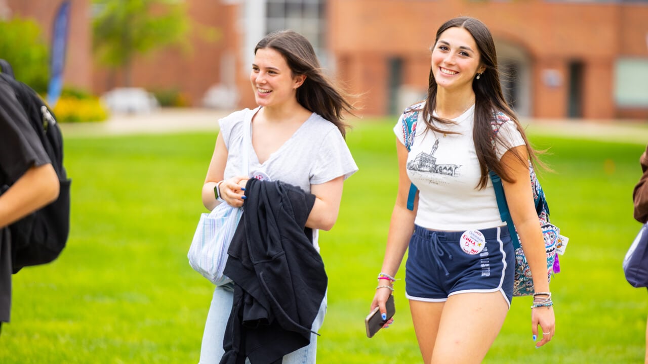 Individuals walking on the Quad during Orientation