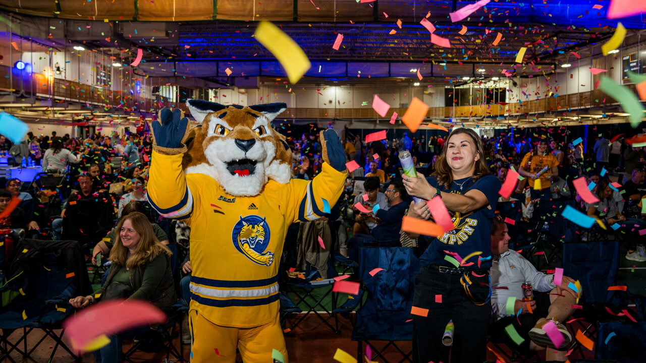 Boomer the Bobcat mascot with confetti
