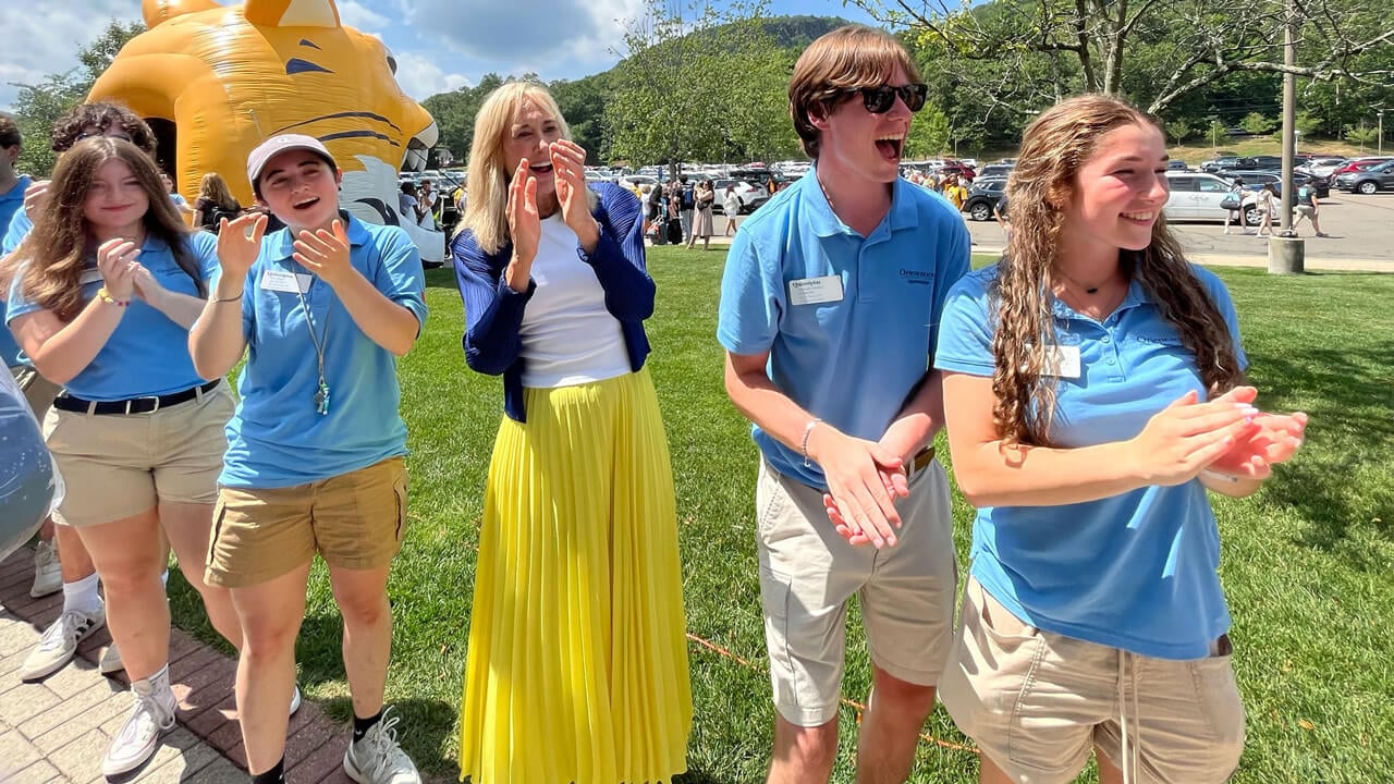 Marie Hardin standing with Orientation Leaders