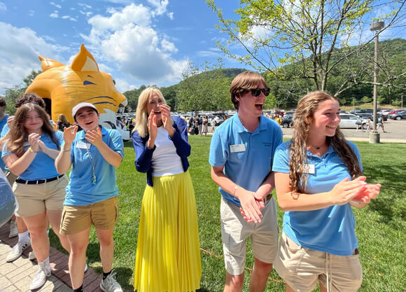 President Marie Hardin stands with Orientation Leaders