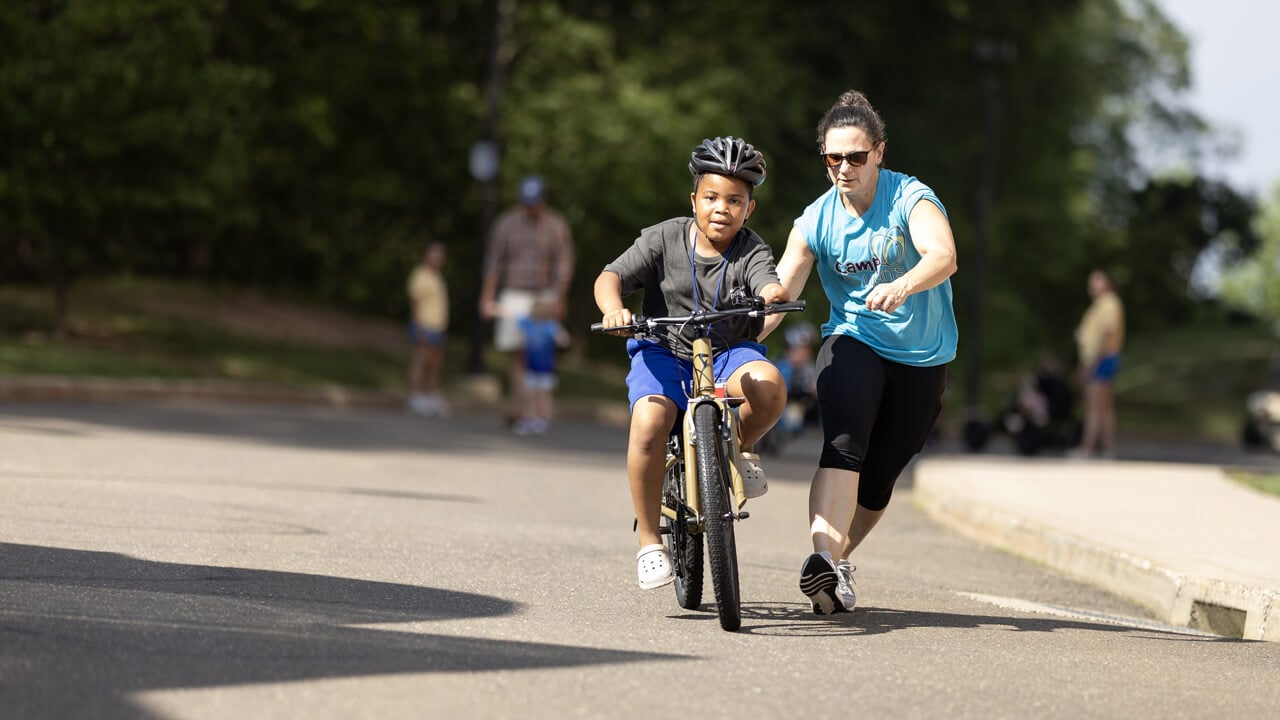 Individual rides a bicycle