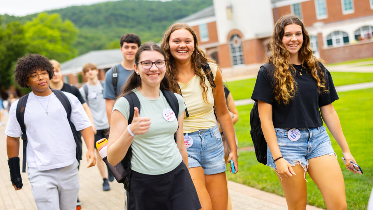 Individuals walking on the Quad during Orientation