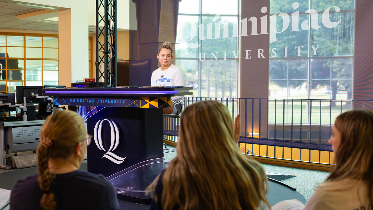 High school students listen during a conference at the Quinnipiac sports communications summer camp.