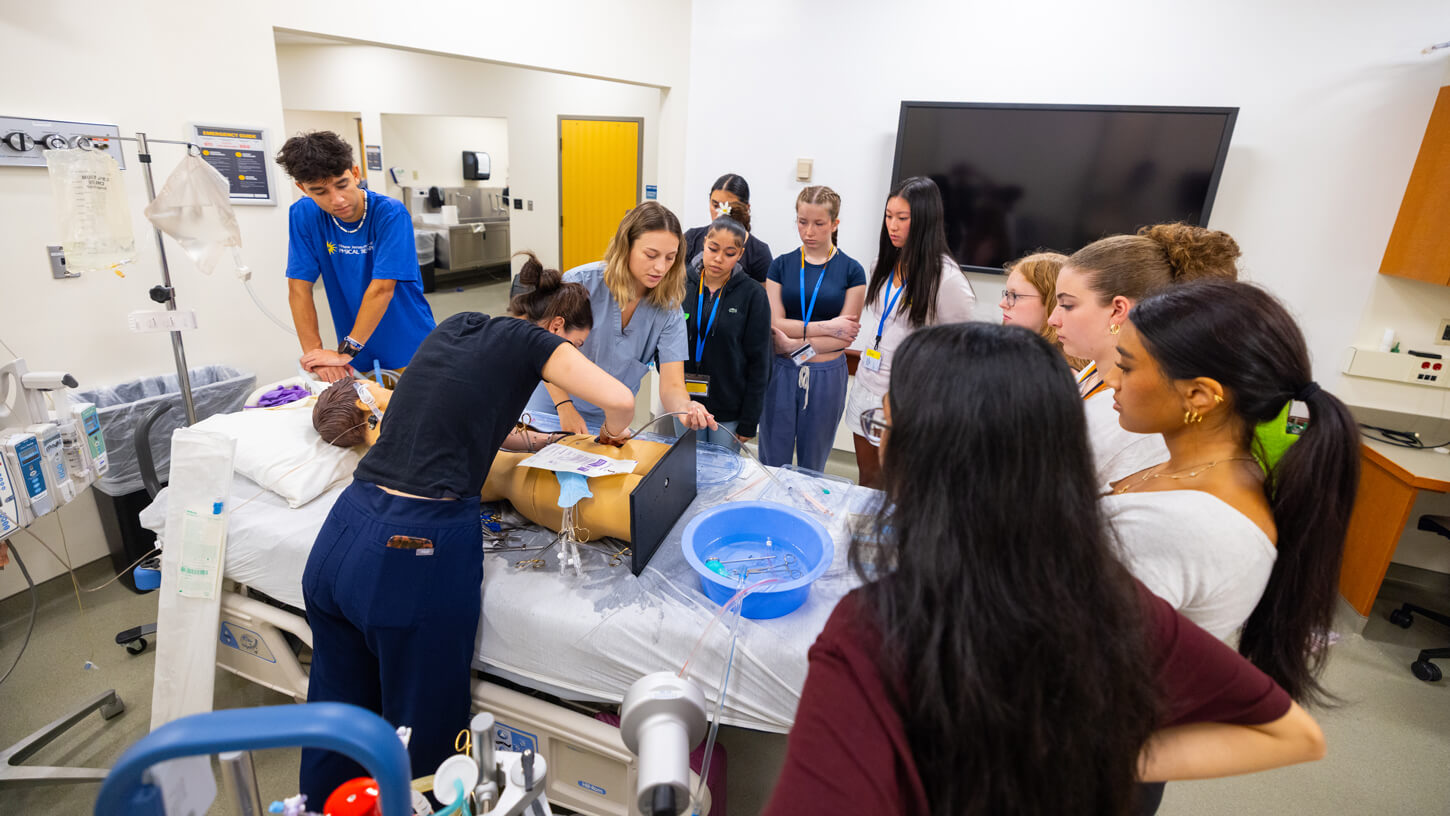 High school students observe and participate in a hands-on demonstration in the North Haven medical facilities.