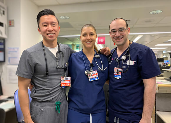 Sondheim pictured with a male and a female colleague