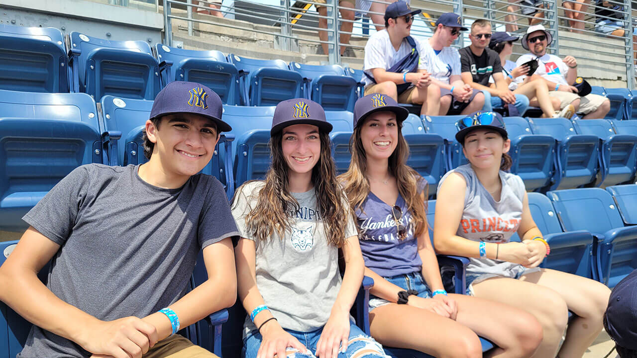 A family sits to watch a baseball game at Yankee Stadium