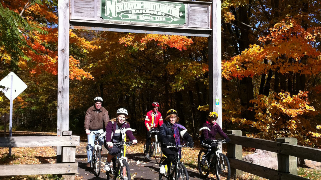 People biking on the Farmington Canal Heritage Trail