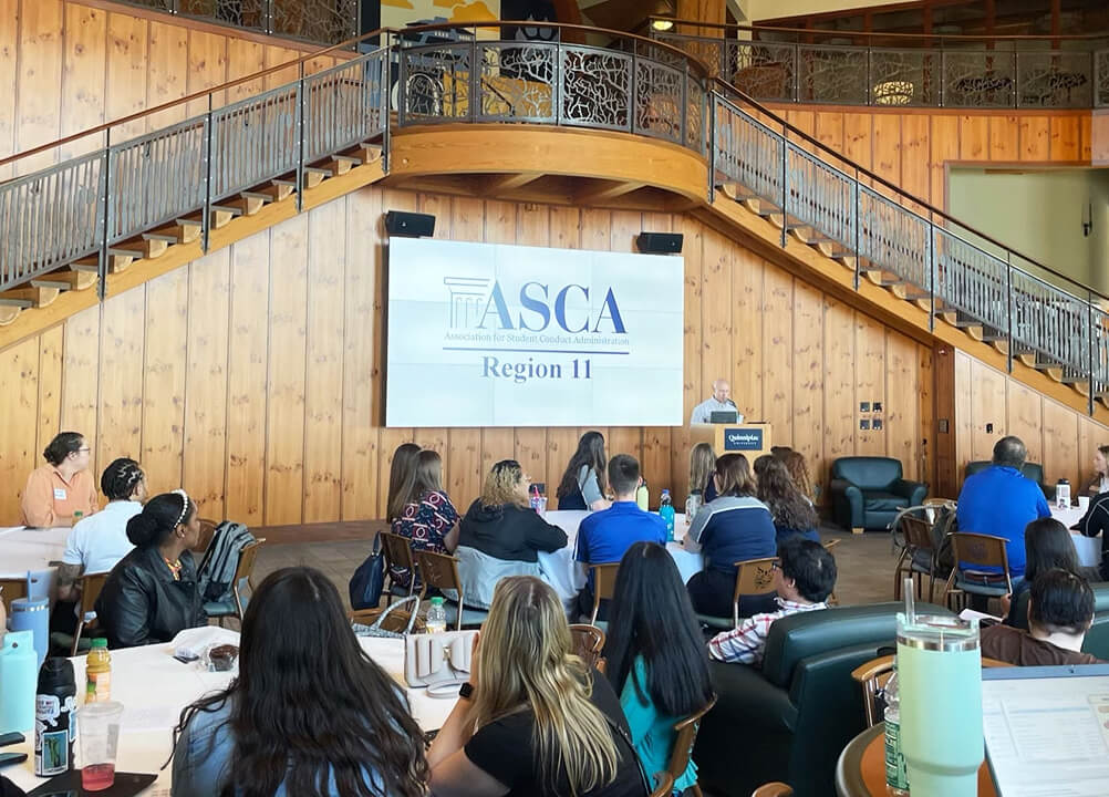 a speaker stand infront of listeners in the Rocky Top student center