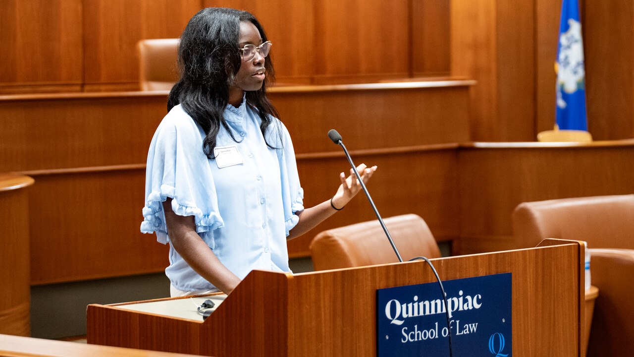 Person speaking at a podium