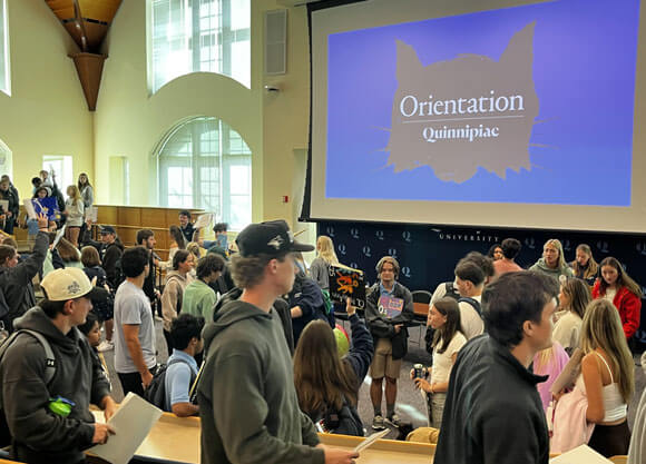 Undergraduates gather together in the Mount Carmel Auditorium for orientation.
