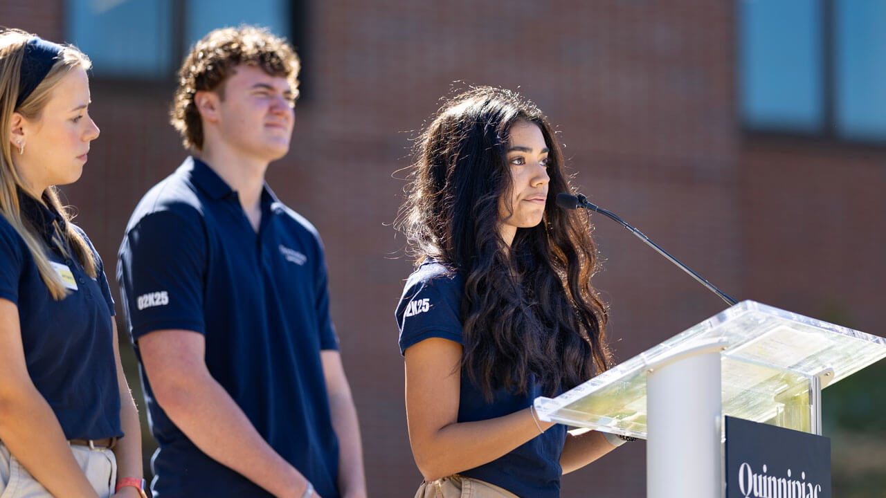 Three students address the class of '29 at a podium