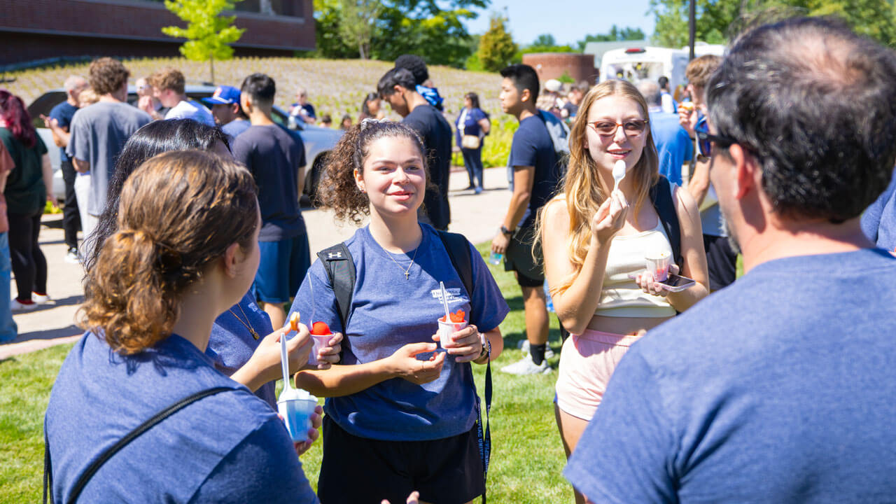 Students enjoy ice cream and talk with friends