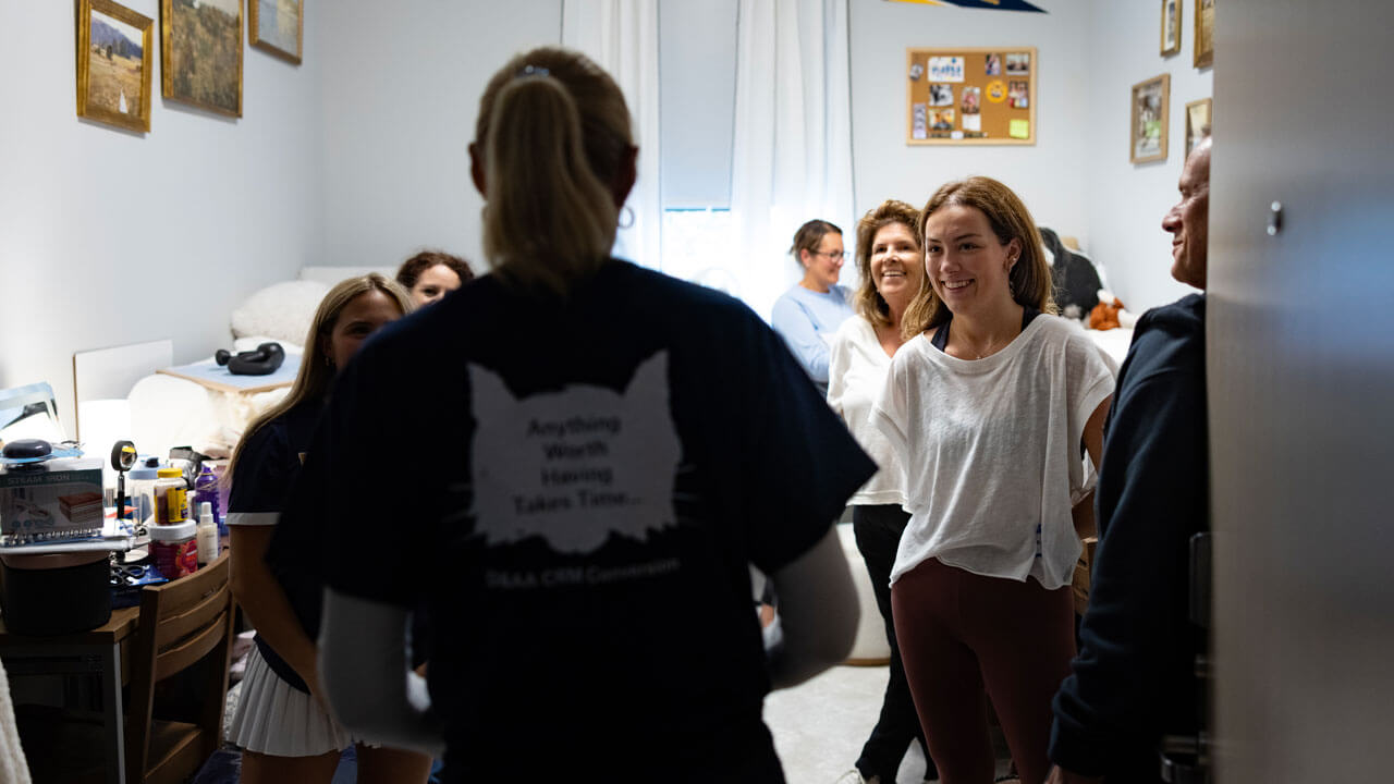 President Marie Hardin greets first year students in their dorms.