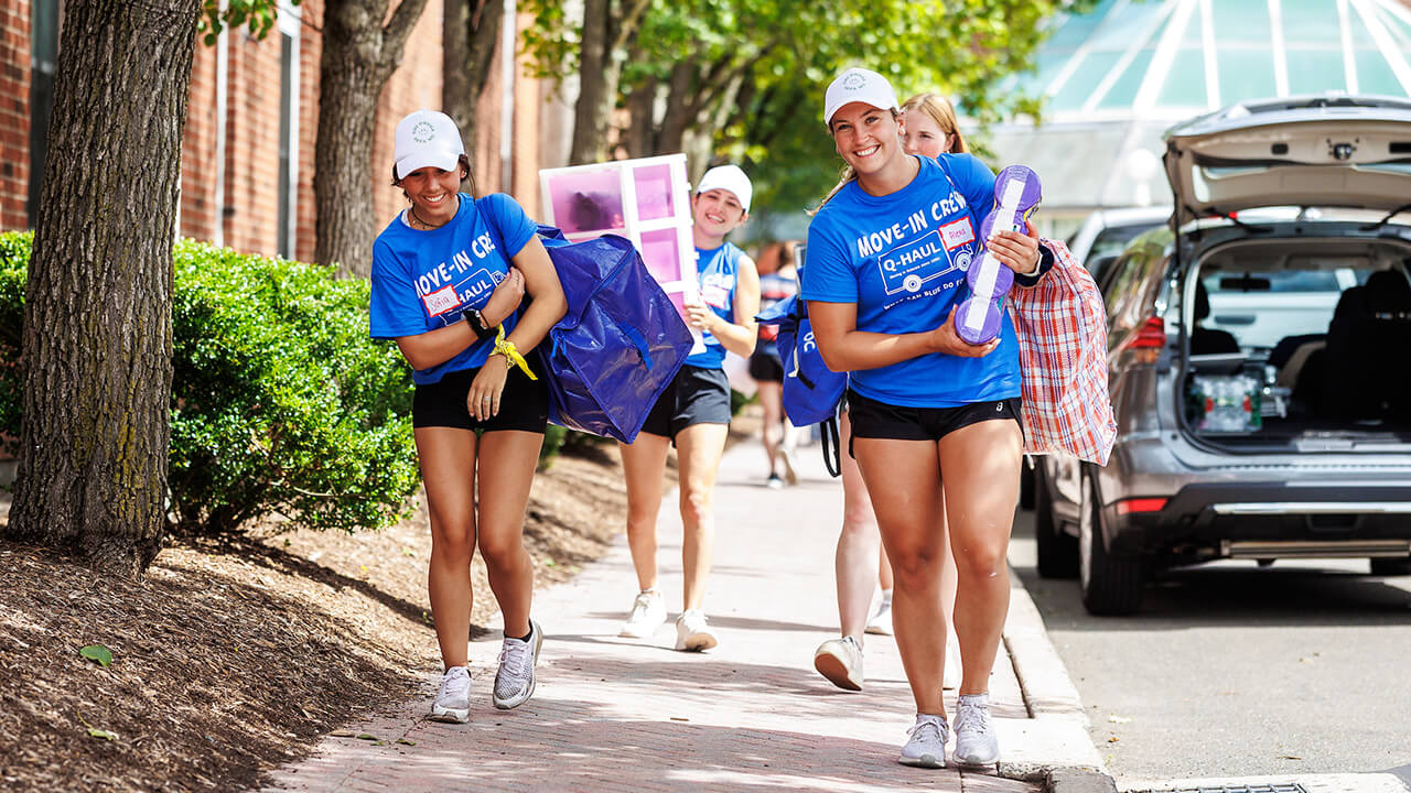 Move-In Crew volunteers laughing.