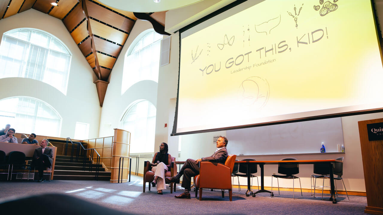 Visual of monitor "You Got This Kid!" and guest speakers