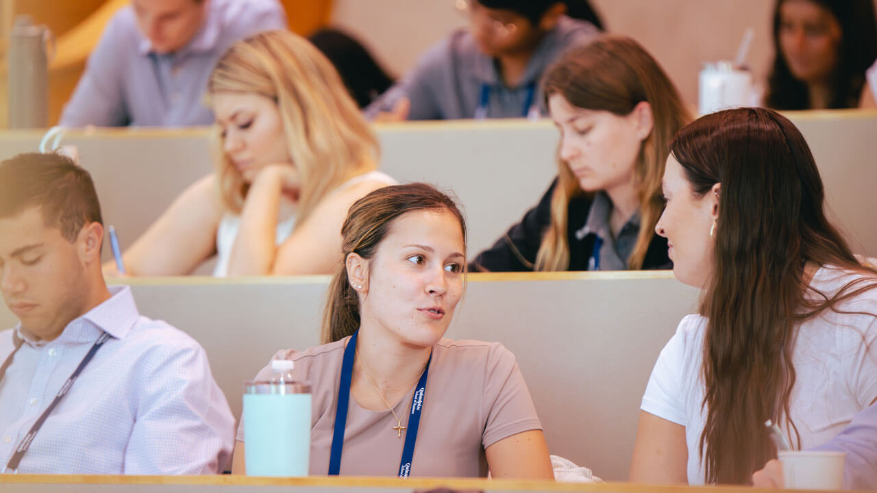 Two grad students engaging in conversation