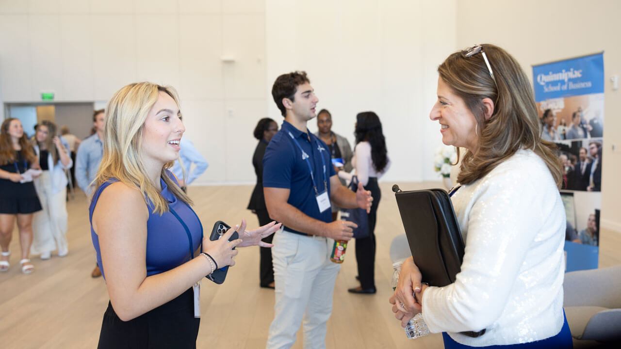 Dean Holly Raider talks to a student