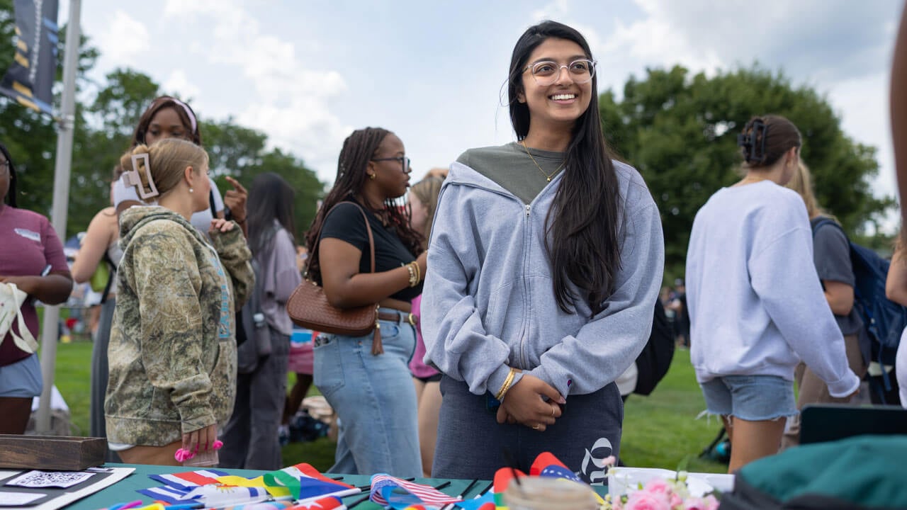Students in engaging conversation at a fair table