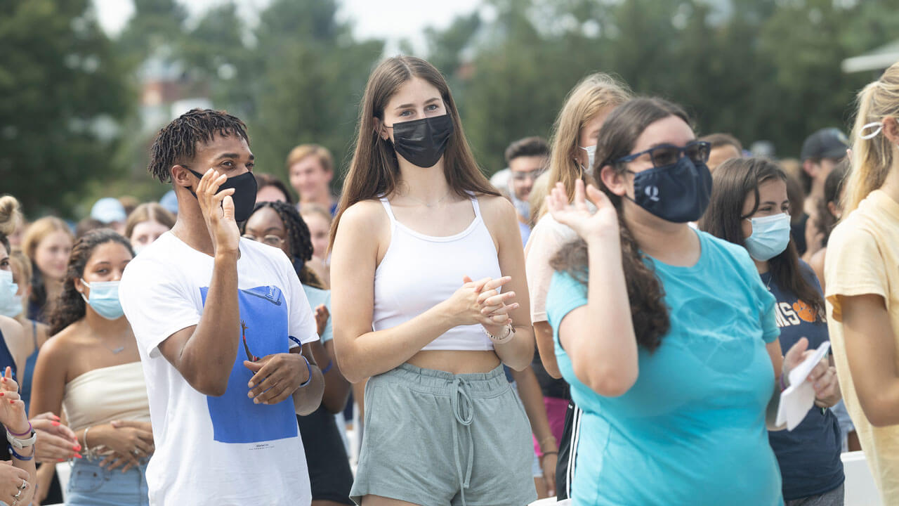 Students stand to recite the student creed