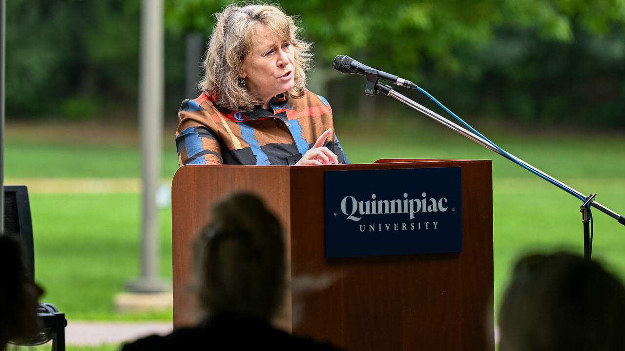 Speaker 2 speaking behind 