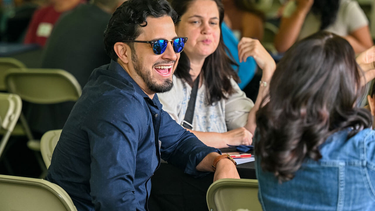 Law students laughing and engaging in conversation
