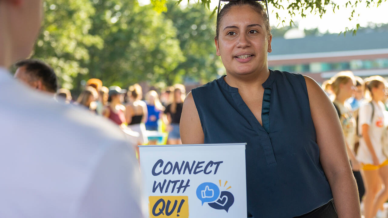A student learns more about connecting with the Quinnipiac community