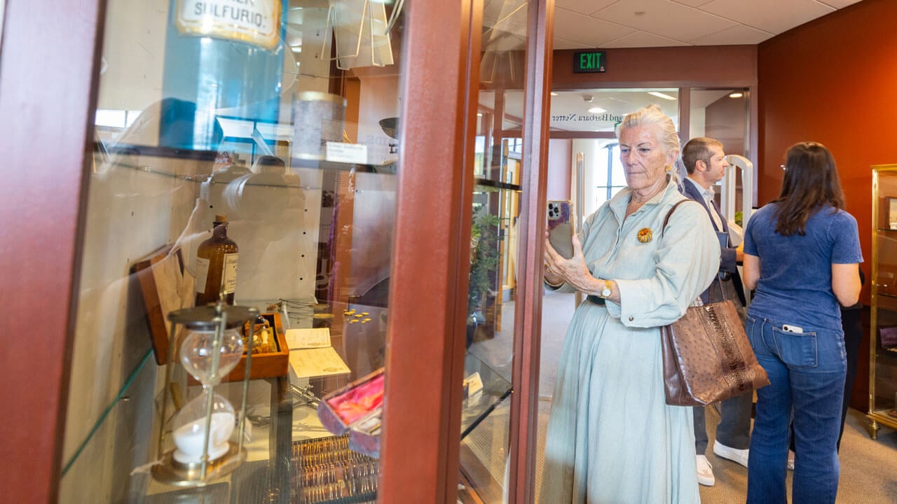 Person admires gallery case