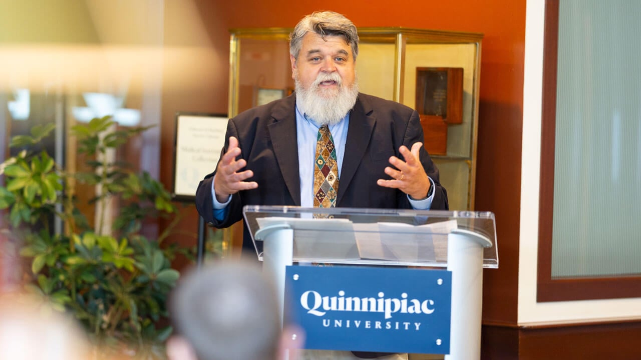 Speaker presents at podium