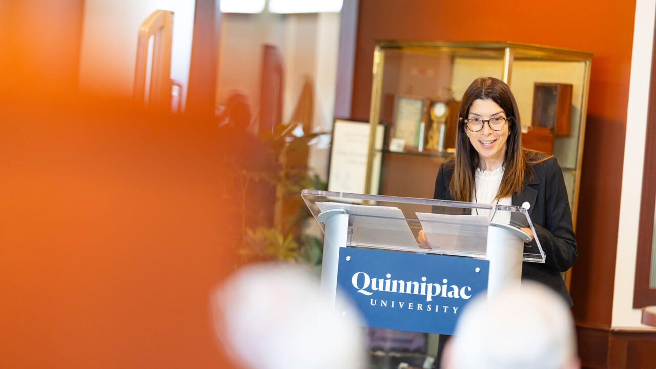 Speaker presents at podium