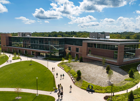 The new School of Business building with vibrant green grass