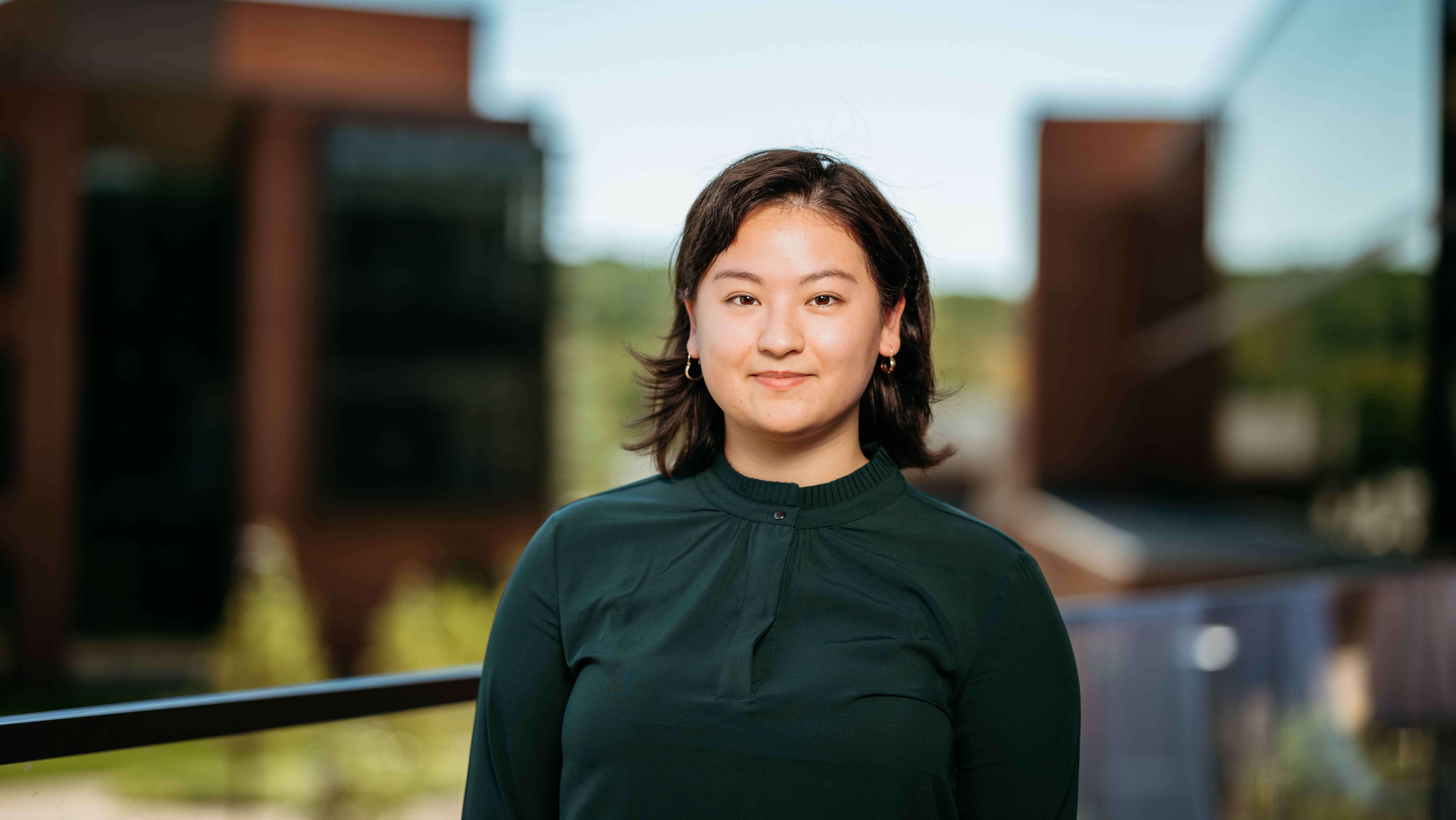 Thamara Benavides, a Sawhney Leadership fellow, poses for a portrait on the balcony of the School of Business on the South Quad.