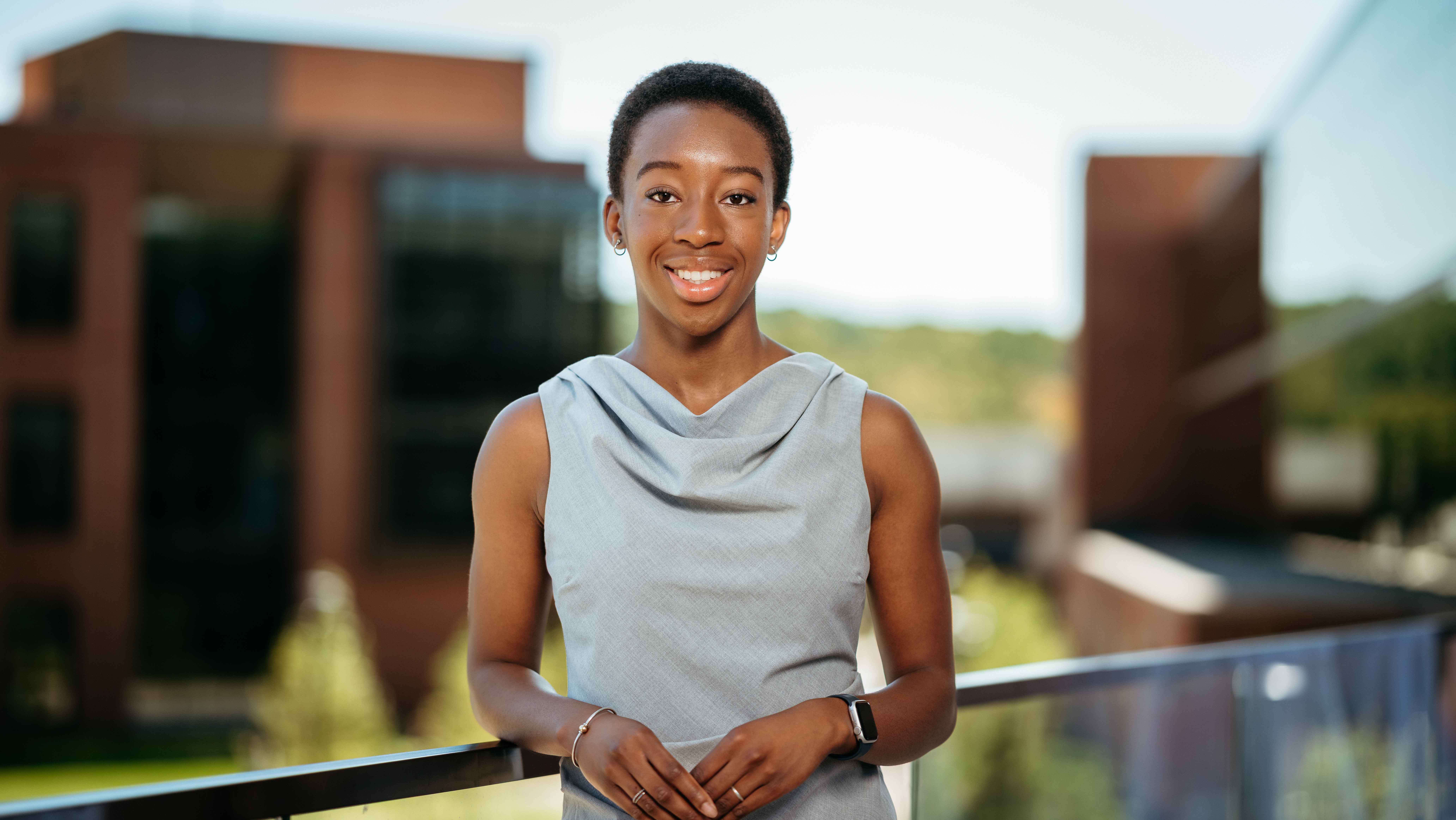 Sarah Ezeh, a Sawhney Leadership fellow, poses for a portrait on the balcony of the School of Business on the South Quad.