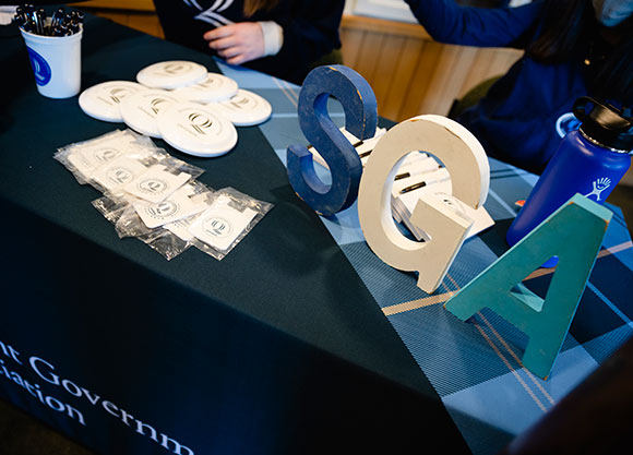 A table with a Student Government Organization sign on it