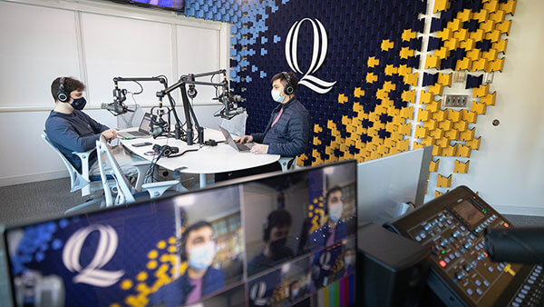 Students record a podcast in the Quinnipiac Podcast Studio.