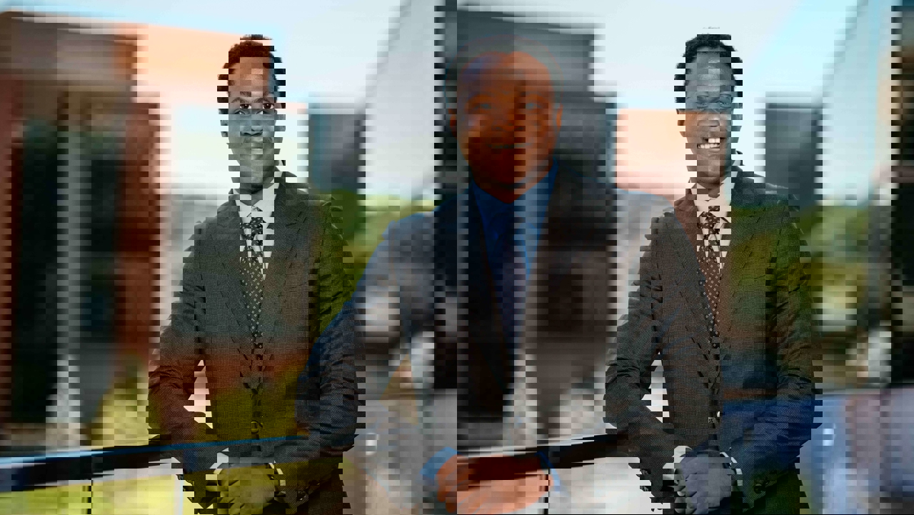 Khalid Abdulraheem, a Sawhney Leadership fellow, poses for a portrait on the balcony of the School of Business on the South Quad.