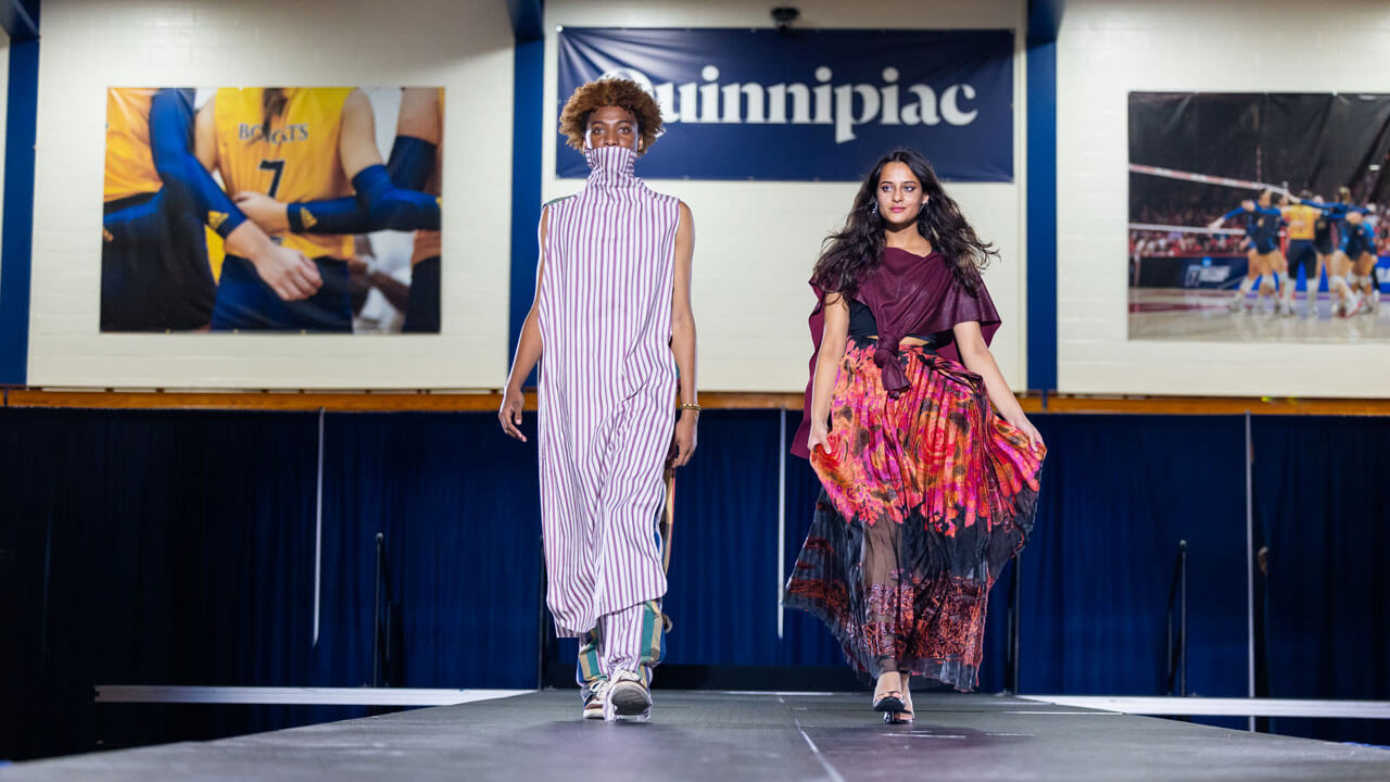Models of the fashion at the Colors of Connecticut festival walk across the stage.
