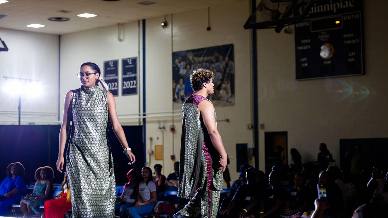 Models of the fashion at the Colors of Connecticut festival walk across the stage.