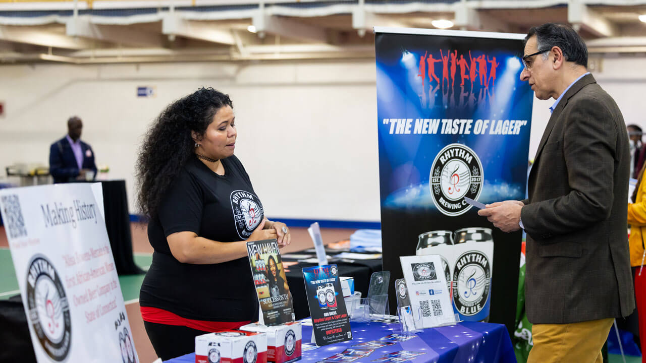 People browse the local booths at the Colors of Connecticut festival.