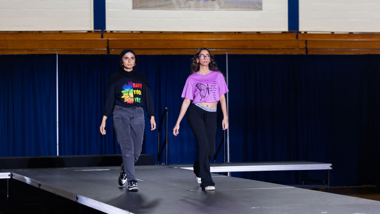 Models of the fashion at the Colors of Connecticut festival walk across the stage.
